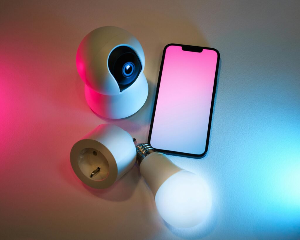 Explore smart home essentials: a smart camera, light bulb, and mobile app control.